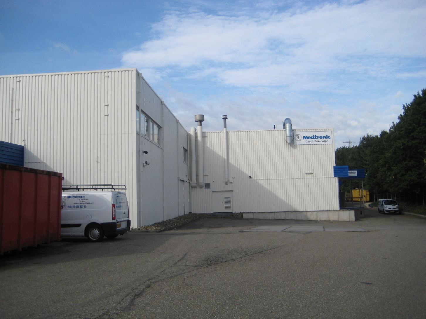 Renovation and repainting of metal cladding on an industrial building